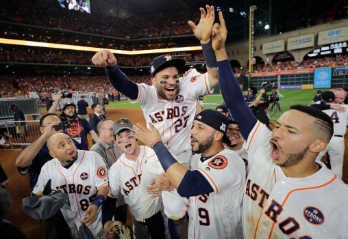 Houston Astros Jose Altuve is lifted by teammates after Game 7 of baseballs American League Championship Series against the New York Yankees Saturday, Oct. 21, 2017, in Houston. The Astros won 4-0 to win the series. (AP Photo/David J. Phillip)