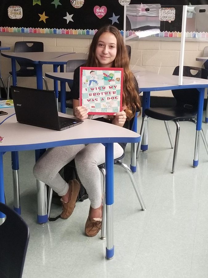  Julia Topsidakis reading her picture book to Daniel Street students.