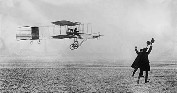 Photo of the Wright Brothers' first flight in their biplane near Kitty Hawk, North Carolina on December 17th, 1903.